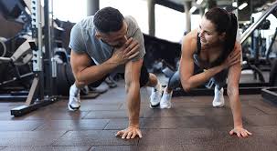 Toning Bingo Wings: Your Ultimate Guide to Sculpting Sleek Arms at the Gym 3 Fitness trainer demonstrating arm toning exercises Bakewell
